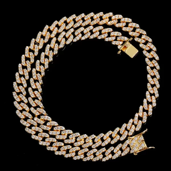 Upgrade your look with the Yellow Gold Iced Prong Miami Cuban Link Chain - 9mm. This stunning piece features a thick, high-quality Yellow Gold plating, ensuring a lasting, luxurious shine that never fades. The VVS Simulated Diamonds have been expertly cut to offer a high refractive index, delivering that signature bling bling look. Whether you're going for a formal vibe or adding some flair to a casual outfit, this chain brings a touch of elegance and style. It's the perfect choice for any Hip Hop fan who values both durability and affordability. Fade-proof, scratch-resistant, and waterproof, it's designed to withstand the test of time.