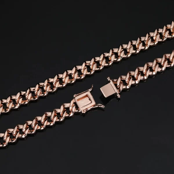 Step up your game with the Rose Gold Iced Prong Miami Cuban Link Chain - 9mm. This piece is coated in thick, high-quality Rose Gold plating that promises long-lasting shine and durability. The VVS Simulated Diamonds add a level of sophistication, with their expert cut ensuring maximum sparkle. Whether you're dressing up or down, the Rose Gold finish gives this chain a warm, luxurious feel. It's scratch-resistant, fade-proof, and designed for those who want to combine style and durability. A perfect choice for anyone looking to make a statement with an affordable, yet elegant, Hip Hop chain.