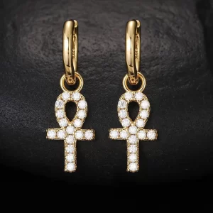 Make a bold statement with the Yellow Gold 925S Moissanite Ankh Cross Hanging Earring. Combining ancient symbolism with modern Hip Hop style, the gold-plated Ankh is encrusted with Moissanite stones that shine brighter than diamonds. This earring is both durable and hypoallergenic, making it perfect for everyday wear or special occasions. Whether you're a fan of history or just want to add a unique piece to your collection, the Yellow Gold Ankh Cross Earring is a standout accessory that mixes meaning and style in true Hip Hop fashion.