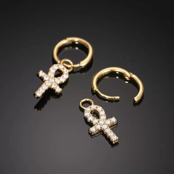 Make a bold statement with the Yellow Gold 925S Moissanite Ankh Cross Hanging Earring. Combining ancient symbolism with modern Hip Hop style, the gold-plated Ankh is encrusted with Moissanite stones that shine brighter than diamonds. This earring is both durable and hypoallergenic, making it perfect for everyday wear or special occasions. Whether you're a fan of history or just want to add a unique piece to your collection, the Yellow Gold Ankh Cross Earring is a standout accessory that mixes meaning and style in true Hip Hop fashion.