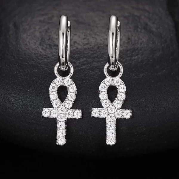 In White Gold, the 925S Moissanite Ankh Cross Hanging Earring offers a sophisticated twist on Hip Hop style. The Moissanite stones add unmatched brilliance, while the durable white gold plating gives this ancient symbol a modern edge. Hypoallergenic and built to last, this earring is perfect for those who appreciate the fusion of historical meaning and street style. Whether you're dressing up for a night out or adding a unique touch to your daily wardrobe, the White Gold Ankh Cross Earring delivers elegance and attitude.