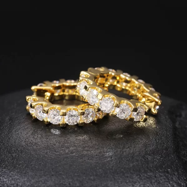 For a bold statement, look no further than the 925S Moissanite Prong Hoop Earring. This 22mm hoop is adorned with high-quality moissanite stones, set in a 925 sterling silver prong setting that maximizes sparkle and durability. With its luxurious Yellow Gold plating, these hoops are perfect for those who want to add serious shine to their Hip Hop-inspired style.