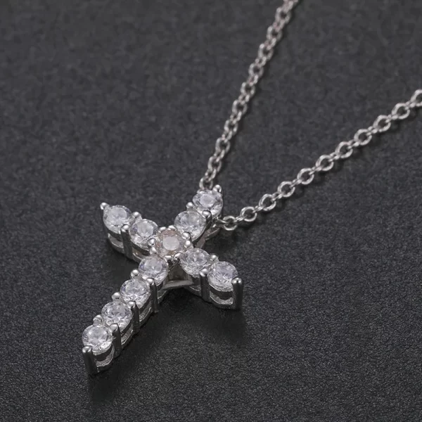 The White Gold 925SS Moissanite Cross Tennis Pendant combines the classic cross with tennis jewelry style. Featuring white gold and Moissanite stones, this hypoallergenic and waterproof pendant is ideal for adding a luxurious Hip Hop touch to any outfit.