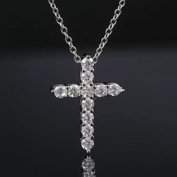 The White Gold 925SS Moissanite Cross Tennis Pendant combines the classic cross with tennis jewelry style. Featuring white gold and Moissanite stones, this hypoallergenic and waterproof pendant is ideal for adding a luxurious Hip Hop touch to any outfit.