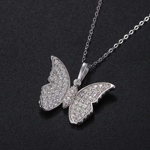 The White Gold 925SS Moissanite Butterfly Pendant captures the essence of transformation and elegance. Made from high-quality 925 sterling silver and adorned with sparkling Moissanite stones, this pendant symbolizes grace and beauty. Its hypoallergenic and waterproof features make it ideal for daily wear, while the intricate butterfly design ensures that it stands out on any occasion. Whether you're looking to elevate a formal outfit or add a touch of sophistication to your casual look, this pendant delivers timeless appeal with a luxurious shine. A perfect choice for anyone who appreciates fine craftsmanship.