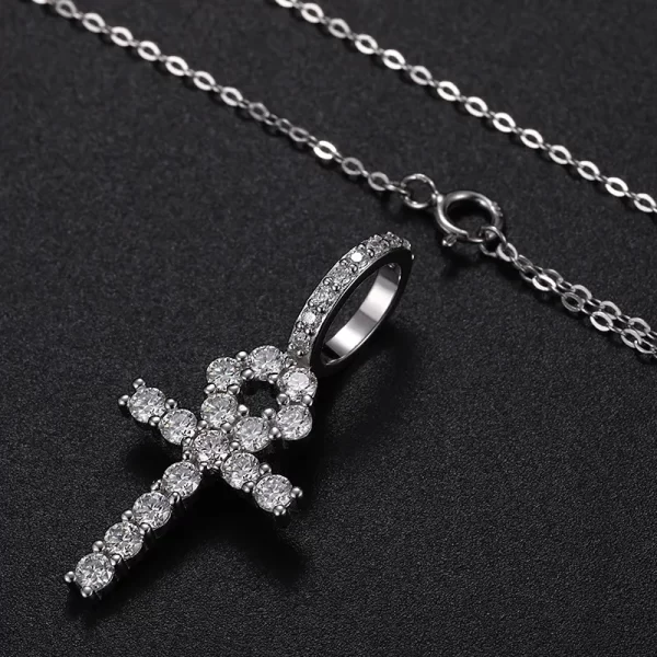 The White Gold 925SS Moissanite Ankh Cross Pendant merges ancient symbolism with modern luxury. Crafted in 925 sterling silver and embellished with brilliant Moissanite stones, this pendant is a powerful symbol of eternal life, blending Egyptian heritage with contemporary style. Its hypoallergenic, scratch-resistant, and waterproof design ensures it can be worn comfortably throughout the day while maintaining its brilliance. Whether you're attending a special event or simply looking for a standout piece, this Ankh cross pendant offers both meaning and elegance, making it a versatile accessory for any occasion.