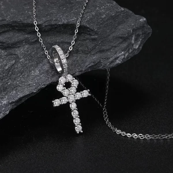 The White Gold 925SS Moissanite Ankh Cross Pendant merges ancient symbolism with modern luxury. Crafted in 925 sterling silver and embellished with brilliant Moissanite stones, this pendant is a powerful symbol of eternal life, blending Egyptian heritage with contemporary style. Its hypoallergenic, scratch-resistant, and waterproof design ensures it can be worn comfortably throughout the day while maintaining its brilliance. Whether you're attending a special event or simply looking for a standout piece, this Ankh cross pendant offers both meaning and elegance, making it a versatile accessory for any occasion.