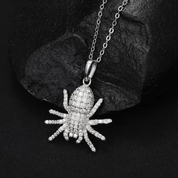 The White Gold 925SS Moissanite Spider Pendant offers a striking mix of boldness and luxury. With sterling silver and Moissanite stones, this hypoallergenic, waterproof piece is perfect for making a daring fashion statement.