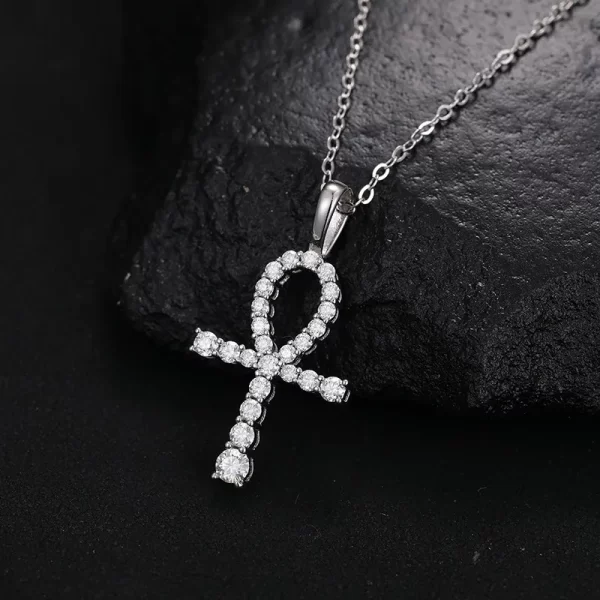 The White Gold 925SS Moissanite Ankh Cross Pendant represents ancient symbolism with modern style. With white gold and Moissanite stones, this hypoallergenic and waterproof pendant is perfect for expressing your love of Hip Hop while embracing timeless meaning.