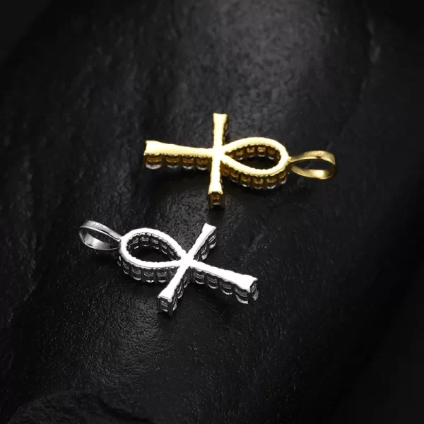 Embrace ancient symbolism with the 925SS Moissanite Ankh Cross Pendant. This pendant, made from sterling silver and adorned with Moissanite stones, symbolizes eternal life and strength. Its sleek design, enhanced by the shimmering stones, makes it a powerful and stylish statement piece. Hypoallergenic and waterproof, this pendant is perfect for those seeking to merge ancient meaning with modern fashion, all while staying true to Hip Hop culture.