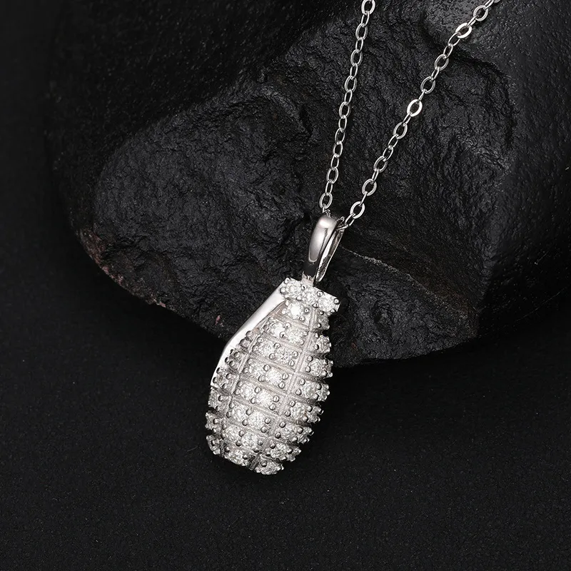 The White Gold 925SS Moissanite Grenade Pendant blends toughness with style. With Moissanite stones and sterling silver, this hypoallergenic, waterproof pendant shines with durability and power.