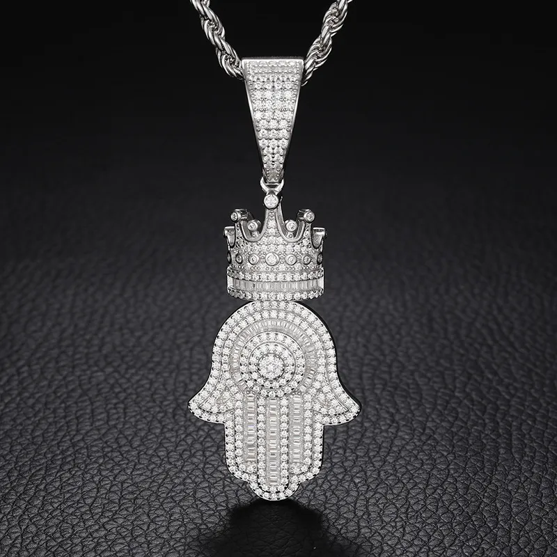 The White Gold 925SS Moissanite Royal Hamsah Hand Pendant symbolizes protection and luxury. With white gold and Moissanite stones, this hypoallergenic and waterproof pendant is perfect for adding cultural significance to any Hip Hop wardrobe.