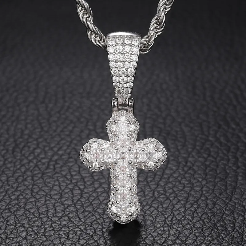 The White Gold 925SS Moissanite Cross Pendant adds a timeless touch to any look. Made from sterling silver and Moissanite stones, this hypoallergenic and waterproof pendant combines luxury and simplicity with a bold Hip Hop edge.