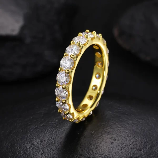 For those who love subtlety, the 925S Moissanite Prong 1 Layer Ring in 4mm offers a refined look with high-shine Moissanite stones set in 925 Sterling Silver. Its Yellow Gold finish adds a touch of warmth and luxury to the sleek design, making it the ideal piece to add a little extra flair to your everyday look while maintaining a low-key luxury aesthetic. This 4mm ring is perfect for Hip Hop enthusiasts who appreciate elegance in their jewelry without overpowering their style.