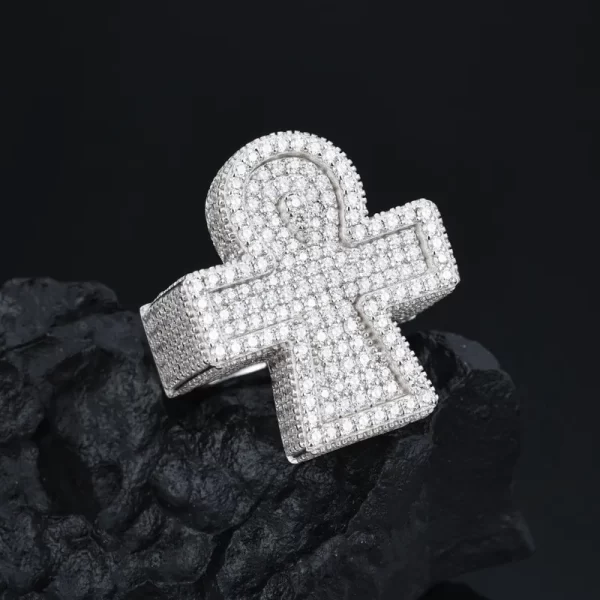 The 925S Moissanite Ankh Cross Ring combines cultural symbolism with Hip Hop style. Featuring the ancient Egyptian Ankh Cross set with Moissanite stones on 925 Sterling Silver, this ring exudes spiritual significance while delivering major bling. Its White Gold finish adds a touch of luxury, making it perfect for those who appreciate bold, meaningful jewelry. Ideal for making a statement, this ring offers a unique blend of symbolism and style for Hip Hop enthusiasts.