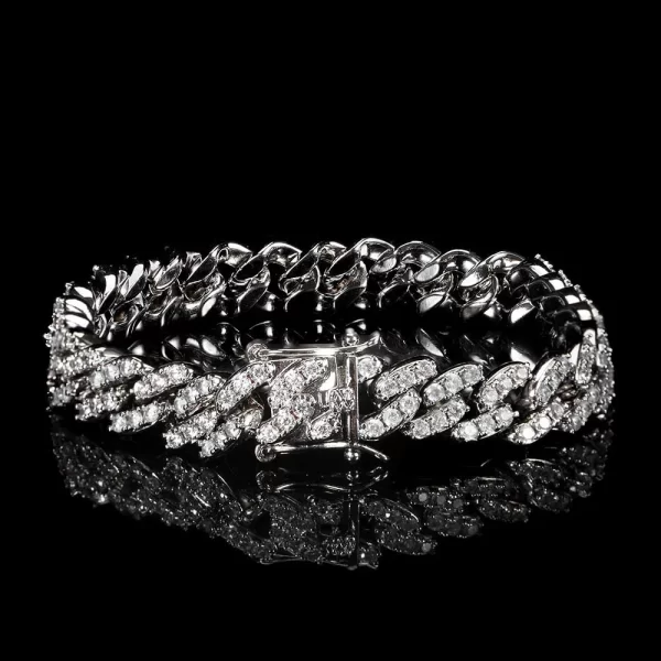 The Iced Prong Miami Cuban Link Bracelet in White Gold - 9mm offers a sleek and modern take on Hip Hop fashion. Prong-set with VVS Simulated Diamonds, this 9mm bracelet is designed to deliver maximum shine while maintaining its luxurious White Gold finish. Its durable design ensures that you can wear it with confidence for both casual and formal events. Perfect for those looking to add a modern, high-end touch to their Hip Hop wardrobe.