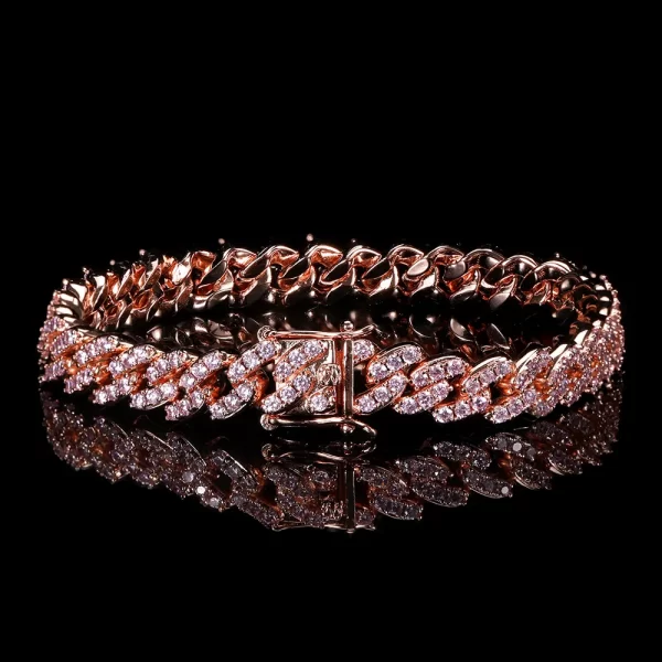 The Iced Prong Miami Cuban Link Bracelet in Rose Gold - 9mm brings an elegant touch of warmth to any Hip Hop style. Featuring prong-set VVS Simulated Diamonds and a rich Rose Gold finish, this bracelet shines in both casual and formal settings. The 9mm width offers a bold yet refined look, making it a must-have for anyone looking to elevate their jewelry collection with a luxurious statement piece.