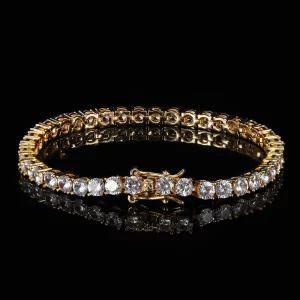 Shine like never before with the Iced Prong Tennis Bracelet in Yellow Gold - 4mm. This bracelet features VVS Simulated Diamonds that are prong-set for maximum brilliance and sparkle. Its 4mm width adds just the right amount of boldness, making it perfect for both casual and formal events. Finished with Yellow Gold Plating, this piece exudes luxury while offering durability and long-lasting shine.