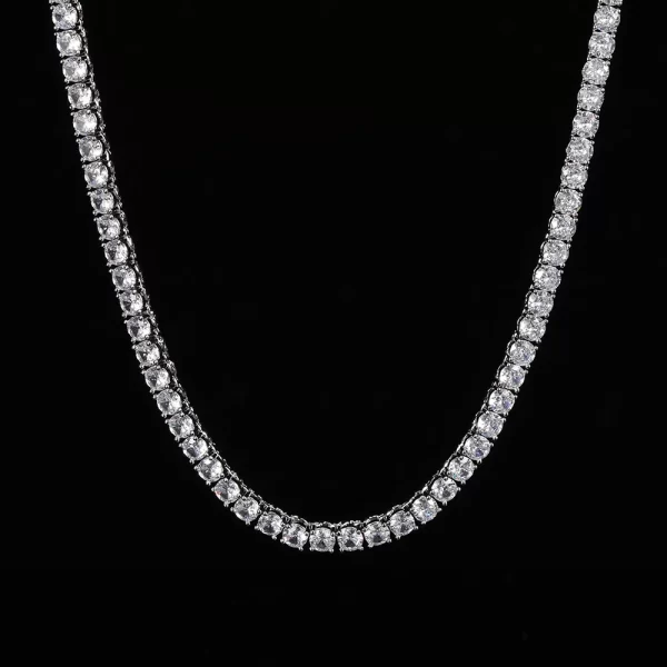 Upgrade your wardrobe with the White Gold Iced Blingbling Tennis Chain - 5mm. This chain combines a sleek White Gold finish with VVS Simulated Diamonds set in a secure prong design for maximum sparkle. Its 5mm width makes it versatile enough to wear on both casual and formal occasions. The White Gold plating ensures durability, with a non-fading, scratch-resistant finish that stands the test of time. Whether worn solo or layered, this chain offers an elegant yet bold look, perfect for any occasion.