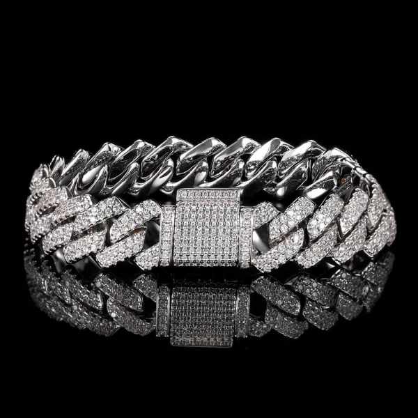 Add some serious bling to your wrist with the Iced Prong Miami Cuban Link Bracelet in White Gold - 14mm. This bold bracelet, with prong-set VVS Simulated Diamonds and a polished White Gold finish, combines the perfect balance of style and strength. The 14mm width adds a standout look, making it ideal for both casual and formal events.