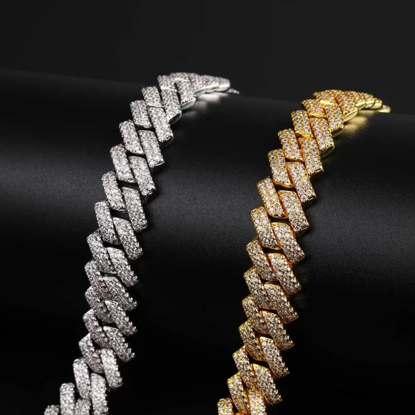 Make a bold statement with the Iced Prong Miami Cuban Link Chain in Yellow Gold. This 14mm wide chain is plated in a luxurious Yellow Gold finish, featuring meticulously cut VVS Simulated Diamonds for an outstanding sparkle. The prong setting ensures maximum brilliance while maintaining durability. Whether worn as a standalone piece or layered with other chains, the Yellow Gold adds an unmatched level of luxury to your collection, making it perfect for both casual and formal Hip Hop aesthetics. This chain is designed to catch the eye and elevate your style.