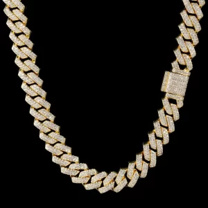 Make a bold statement with the Iced Prong Miami Cuban Link Chain in Yellow Gold. This 14mm wide chain is plated in a luxurious Yellow Gold finish, featuring meticulously cut VVS Simulated Diamonds for an outstanding sparkle. The prong setting ensures maximum brilliance while maintaining durability. Whether worn as a standalone piece or layered with other chains, the Yellow Gold adds an unmatched level of luxury to your collection, making it perfect for both casual and formal Hip Hop aesthetics. This chain is designed to catch the eye and elevate your style.