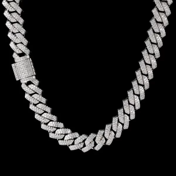 Upgrade your collection with the Iced Prong Miami Cuban Link Chain in White Gold. Featuring a 14mm wide design, this chain showcases stunning VVS Simulated Diamonds meticulously set in a prong arrangement for maximum shine. The White Gold plating provides a sleek and modern look, making it perfect for layering or wearing solo. Whether you're attending a formal event or dressing up your street style, the White Gold finish offers a cool, contemporary edge that pairs well with any outfit.