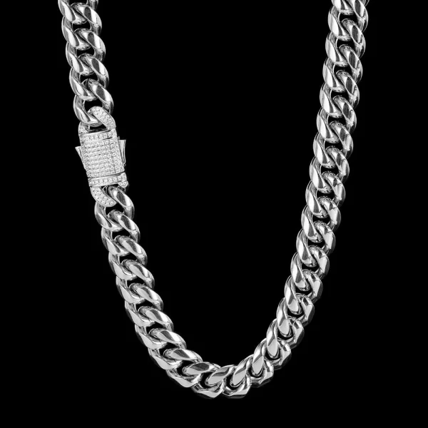 Enhance your wardrobe with the Iced Stainless Steel Cuban Link Chain in White Gold. This 10/12mm chain is designed to catch attention, featuring meticulously cut VVS Simulated Diamonds that sparkle in any light. Plated in a sleek White Gold finish, this chain offers a contemporary take on the classic Cuban Link design. Its durable stainless steel construction ensures lasting quality, making it perfect for anyone looking to add a touch of luxury to their everyday or formal attire.