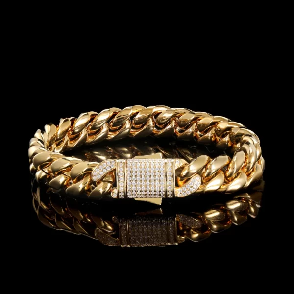 Upgrade your wrist game with the Iced Stainless Steel Cuban Link Bracelet in Yellow Gold - 10/12mm. This bold bracelet features a thick Cuban link design crafted from durable stainless steel, finished with a luxurious Yellow Gold Plating. It is iced out with VVS Simulated Diamonds for maximum sparkle. Waterproof and scratch-resistant, this bracelet is perfect for adding a statement to both casual and formal styles, offering durability and luxury.