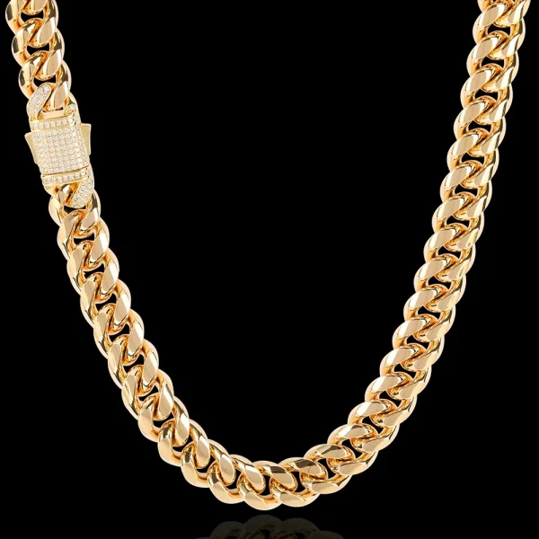 Elevate your collection with the Iced Stainless Steel Cuban Link Chain in Yellow Gold. Crafted from durable stainless steel, this chain features a bold 10/12mm width and is plated in a rich Yellow Gold finish. The Iced Out design showcases VVS Simulated Diamonds for maximum brilliance, making it perfect for special occasions or adding a touch of luxury to your daily style. The Yellow Gold finish complements its high-end look, offering a timeless appeal that blends durability with undeniable style.