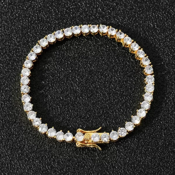 The Iced Prong Tennis Bracelet in Yellow Gold - 4mm delivers sleek elegance with a hint of luxury. This bracelet features prong-set VVS Simulated Diamonds along its 4mm width, giving off a refined shine. The Yellow Gold finish ensures both durability and style, making it perfect for both everyday wear and special occasions. Whether you're layering it with other bracelets or wearing it solo, this 4mm piece adds a subtle yet stylish bling to your wrist, perfect for Hip Hop lovers who want to add a touch of sophistication to their collection.