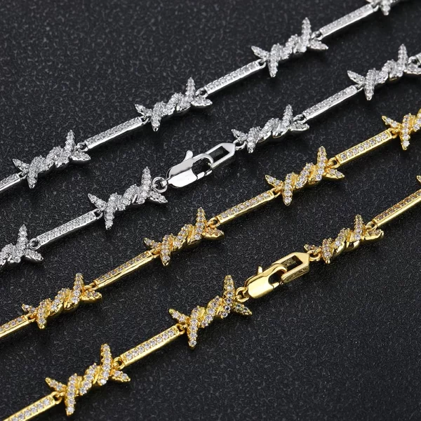 Make a statement with the Iced Thorns Chain in White Gold. This 3mm chain showcases sharp, thorn-like edges paired with a brilliant White Gold finish and VVS Simulated Diamonds. The sleek, minimalist design is perfect for those who want to add a touch of rebellion to their refined style. Whether you're dressing up or keeping it casual, this chain ensures your look stands out with a modern, edgy flair, making it ideal for anyone who loves bold, eye-catching jewelry.