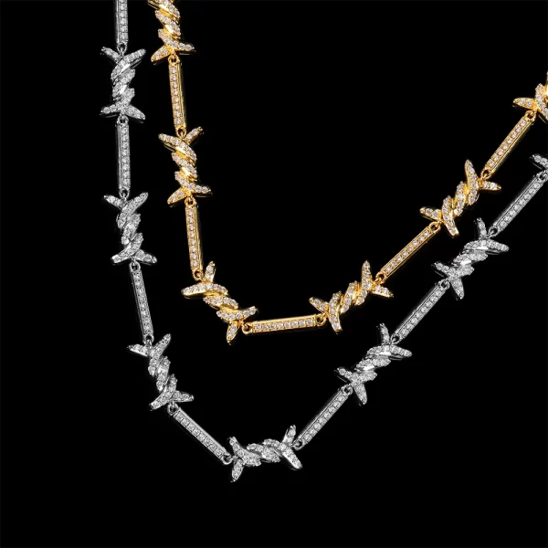 Add some edge to your style with the Iced Thorns Chain in Yellow Gold. This 3mm chain stands out with its unique thorn design, plated in stunning Yellow Gold and set with VVS Simulated Diamonds for a bold, dazzling look. The combination of sharp edges and brilliant shine makes this chain ideal for those who want to showcase their rebellious side while maintaining luxury and elegance. Wear it for both casual outings and special occasions, adding a daring, standout piece to your wardrobe.