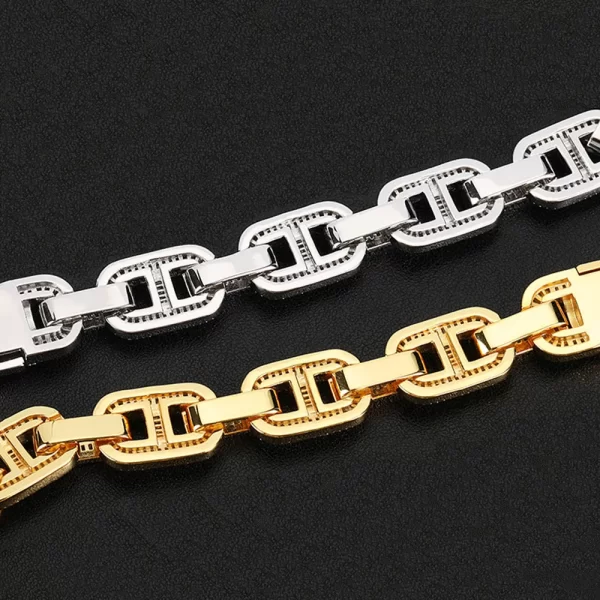 The Iced Square Mariner Link Bracelet in White Gold - 15mm is a perfect combination of elegance and boldness for Hip Hop fashion lovers. This 15mm bracelet features prong-set VVS Simulated Diamonds in square mariner links, giving it a distinct shine and luxurious touch. The White Gold finish adds durability while maintaining an upscale look. Perfect for both casual and formal occasions, this bracelet offers a standout style that effortlessly blends modern design with Hip Hop flair.