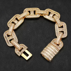 The Iced Square Mariner Link Bracelet in Yellow Gold - 15mm combines elegance with a rugged edge, perfect for Hip Hop enthusiasts who appreciate a bold look. Featuring VVS Simulated Diamonds set in square mariner links, this bracelet shines with unmatched brilliance. The Yellow Gold finish adds a luxurious touch, ensuring durability while offering a statement piece for both casual and formal wear. Whether layered or worn solo, this 15mm bracelet brings a unique style that blends luxury and boldness, making it a must-have for any serious jewelry collection.