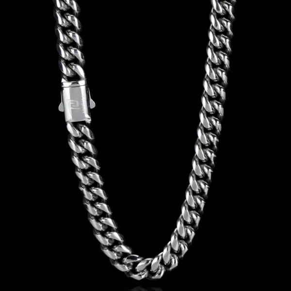 Shine with the Stainless Steel Cuban Link Chain in White Gold. This 8¨C14mm chain is finished with high-grade White Gold Plating, offering a sleek, modern look. The durable stainless steel construction ensures longevity, while the VVS Simulated Diamonds add a touch of brilliance to the bold Cuban links. Whether you're layering it for casual wear or making a statement at formal events, the White Gold finish ensures a clean, polished appearance that never goes unnoticed.