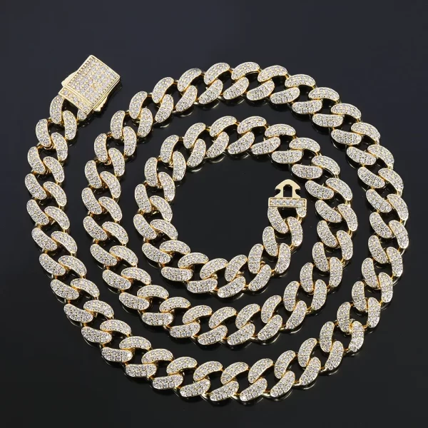 Make a bold statement with the Iced Prong Miami Cuban Link Chain in Yellow Gold - 12mm. This Cuban link chain is designed to deliver maximum shine with prong-set VVS Simulated Diamonds and a luxurious Gold Plated finish. Its 12mm width ensures a substantial presence, making it ideal for both casual and formal events. The warm, radiant Yellow Gold finish adds a touch of luxury, while the intricate prong setting ensures that the diamonds dazzle in any light, making this chain a must-have for those who want to elevate their Hip Hop style.