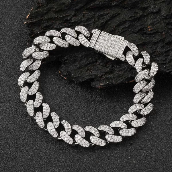 The Iced Prong Miami Cuban Link Bracelet in White Gold - 12mm is designed for Hip Hop lovers who want to add a sleek, modern touch to their jewelry. This bracelet features prong-set VVS Simulated Diamonds for maximum brilliance, while the White Gold finish offers durability and a timeless aesthetic. Its 12mm width ensures that this piece makes a bold statement, perfect for both casual wear and special events. Add this bracelet to your collection for a refined yet striking look.