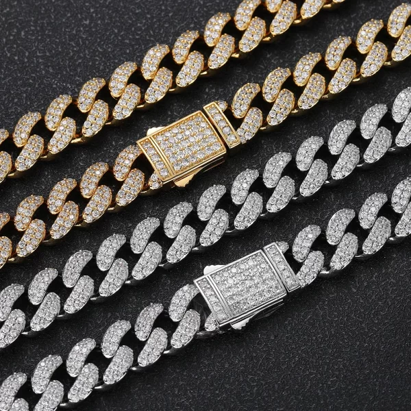 Upgrade your style with the Iced Prong Miami Cuban Link Chain in White Gold - 12mm. This chain features meticulously prong-set VVS Simulated Diamonds for a brilliant shine, while its White Gold finish offers a sleek and sophisticated look. The 12mm width gives it a bold presence, making it perfect for both casual and formal occasions. The modern, icy finish adds a refined touch, ensuring that this White Gold chain will be the centerpiece of any outfit, making you stand out in style.