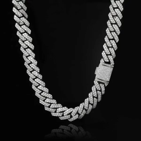 Upgrade your collection with the Iced Prong Diamond Miami Cuban Link Chain in White Gold. Featuring prong-set VVS Simulated Diamonds for ultimate shine, this 15mm wide Cuban link chain offers both durability and elegance. The White Gold finish elevates its sophisticated appearance, making it a must-have for special occasions and everyday wear. Whether layered or worn solo, this chain guarantees a luxurious touch to your outfit, adding that signature bling that never goes unnoticed.