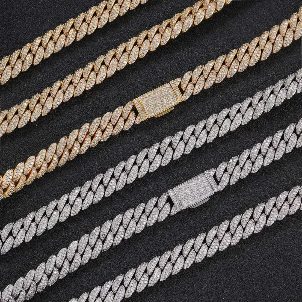 Make a bold statement with the Iced Prong Miami Cuban Link Chain in Yellow Gold - 12mm. This 12mm Cuban link chain is crafted with prong-set VVS Simulated Diamonds for maximum brilliance. Its Gold Plated finish adds a luxurious touch, making it ideal for both casual wear and formal events. Whether you¡¯re looking to stand out or elevate your everyday style, this chain is the perfect addition to any collection, with the warm Yellow Gold finish ensuring maximum impact.