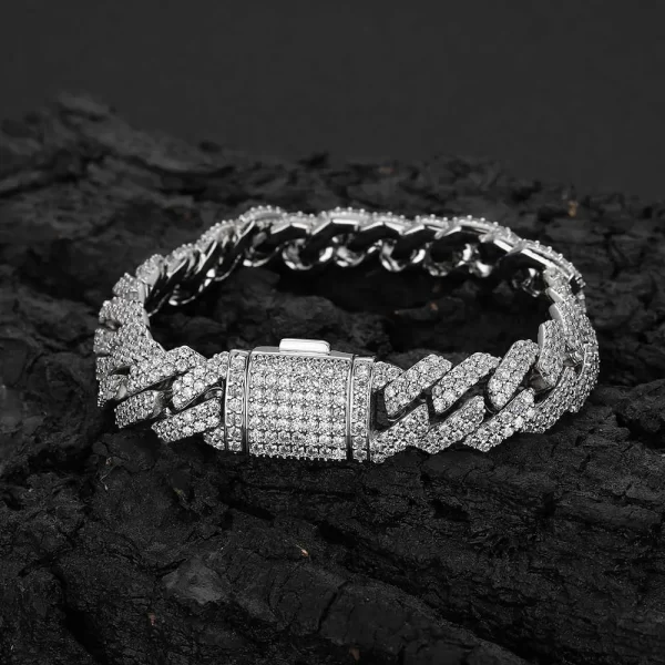 The Iced Diamond Miami Cuban Link Bracelet in White Gold - 12mm combines street style with high-end sophistication. Featuring prong-set VVS Simulated Diamonds in a classic Cuban link design, this bracelet offers unmatched brilliance. The White Gold finish adds a sleek, modern touch, making this 12mm bracelet perfect for both everyday wear and special events. Ideal for Hip Hop enthusiasts who love to make a statement, this bracelet is a must-have addition to any collection.