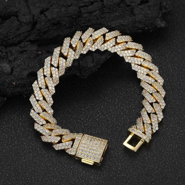 Shine with confidence wearing the Iced Diamond Miami Cuban Link Bracelet in Yellow Gold - 12mm. This bracelet features VVS Simulated Diamonds in a classic Cuban link design, offering maximum brilliance. The Yellow Gold Plating adds a luxurious touch, making this the perfect accessory for those who love to blend street style with high-end fashion. Whether worn for special occasions or as an everyday statement piece, this 12mm bracelet ensures you stand out with elegance and flair.