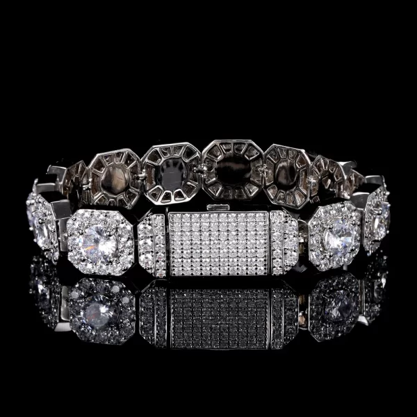 Shine bright with the Iced Square Tennis Bracelet in White Gold - 10/12mm. The sleek square-set VVS Simulated Diamonds, combined with a White Gold finish, make this bracelet the perfect accessory for those who love the luxurious, bold style of Hip Hop fashion.