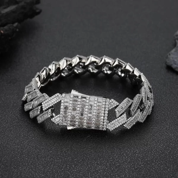 The Iced Diamond Miami Cuban Link Bracelet in White Gold - 18mm combines luxurious style with bold Hip Hop aesthetics. Featuring prong-set VVS Simulated Diamonds, this bracelet shines in any setting, while the White Gold finish ensures durability. Its 18mm width adds a bold touch, perfect for making a statement with your accessories.