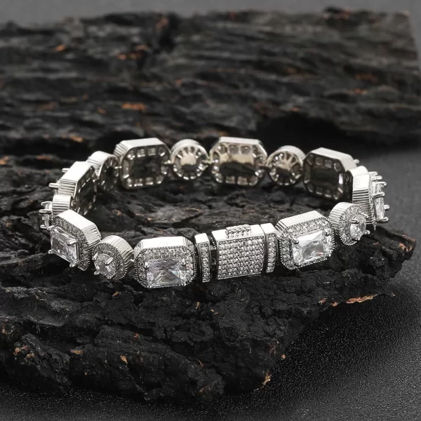 Add some sparkle to your wrist with the Square Diamond Tennis Bracelet in White Gold - 6mm. Featuring square-set VVS Simulated Diamonds and a sleek White Gold finish, this bracelet is perfect for Hip Hop enthusiasts who want to add both elegance and shine to their style.