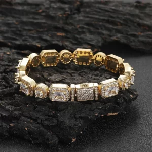 Add some sparkle to your wrist with the Square Diamond Tennis Bracelet in Yellow Gold - 6mm. Prong-set VVS Simulated Diamonds in a sleek square setting deliver maximum shine, while the Yellow Gold Plating adds a touch of elegance. This bracelet is perfect for both casual and formal Hip Hop events, making it a versatile addition to any wardrobe.