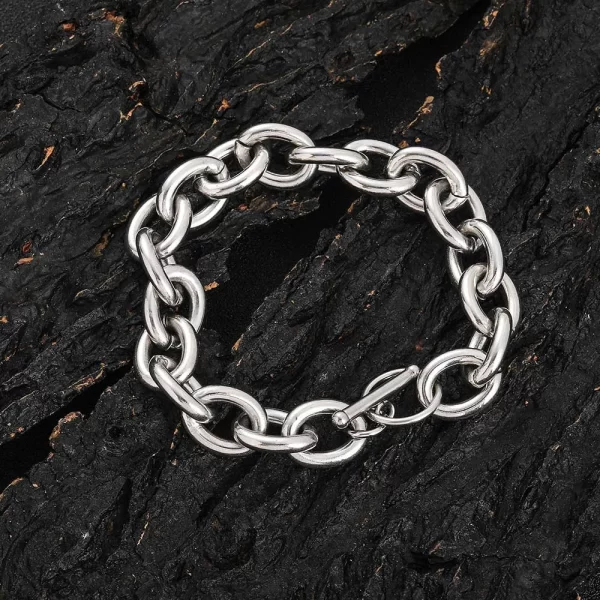 The Stainless Steel 18K Gold Rolo Bracelet - 12mm in White Gold offers a sleek and polished look for those who appreciate both style and durability. Featuring classic Rolo links, this bracelet is finished with White Gold Plating, making it perfect for both casual wear and special occasions. The 12mm width adds a bold statement to any outfit, ideal for Hip Hop fans who want to blend luxury with street style.