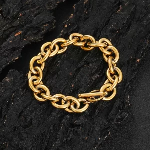 The Stainless Steel 18K Gold Rolo Bracelet - 12mm combines timeless elegance with modern durability. This bracelet features Rolo links crafted from Stainless Steel with a luxurious 18K Gold Plating finish. The 12mm width makes it bold enough to stand out, while remaining sleek enough for everyday wear or formal occasions. Perfect for Hip Hop lovers who appreciate refined style, this bracelet adds a touch of class to any outfit, making it a versatile accessory for any collection.