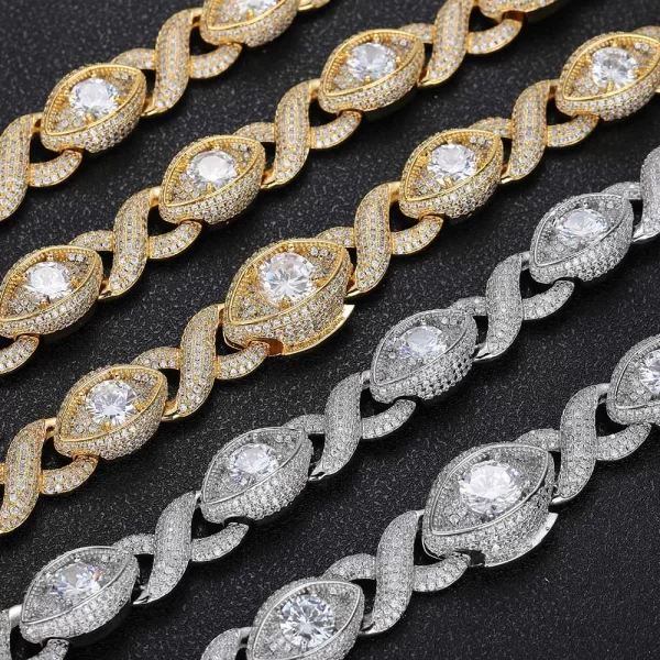 Upgrade your style with the Iced Infinite Eyes 8-Shaped Link Chain in Yellow Gold. This unique 15mm chain is designed to make a statement with its dazzling VVS Simulated Diamonds and intricate 8-shaped design. Plated in rich Yellow Gold, this piece offers both luxury and a distinctive look, perfect for anyone who wants to stand out. The attention to detail and bold structure make it suitable for casual streetwear or formal events, giving your outfit a one-of-a-kind Hip Hop appeal.